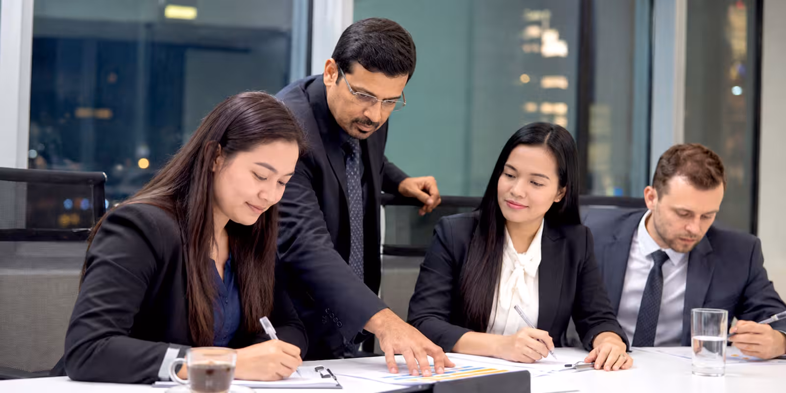 Finance professionals examining audit records together